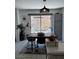 Dining area with stylish light fixture and backyard views at 682 Corte Madera Ave, Henderson, NV 89015