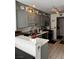 Well-equipped kitchen with grey cabinets, stainless appliances, and sleek countertops at 682 Corte Madera Ave, Henderson, NV 89015