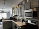 Bright and modern kitchen with grey cabinets and stainless steel appliances at 682 Corte Madera Ave, Henderson, NV 89015