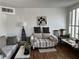Comfortable living room featuring stylish sofas, art, and bright natural light at 682 Corte Madera Ave, Henderson, NV 89015