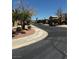 Street view of a neighborhood with two-story homes and landscaping, with vehicle traffic on newly paved roads at 682 Corte Madera Ave, Henderson, NV 89015