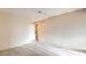 Spacious, empty bedroom with neutral walls and light gray flooring for a blank canvas at 6861 Tamarus St # 203, Las Vegas, NV 89119