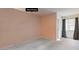 An empty bedroom shows potential with gray flooring, neutral walls, and natural light through the window at 6861 Tamarus St # 203, Las Vegas, NV 89119