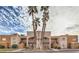 Exterior of building featuring palm trees and a community at 6861 Tamarus St # 203, Las Vegas, NV 89119
