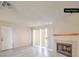 Bright living room with fireplace and sliding glass door for natural light, offers a cozy and inviting space at 6861 Tamarus St # 203, Las Vegas, NV 89119