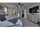 This modern bedroom features a king bed, dresser, and a convenient door to hallway and bathroom at 7194 Sage Wren Ct, Las Vegas, NV 89148