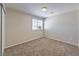 Cozy bedroom with carpet and window at 7633 Raven Hills Dr, Las Vegas, NV 89149