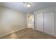 Neutral bedroom featuring plush carpeting, closet, and an adjoining bathroom at 7633 Raven Hills Dr, Las Vegas, NV 89149