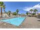 Large community pool with ample deck space and plenty of lounge chairs for residents at 7633 Raven Hills Dr, Las Vegas, NV 89149
