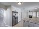 Updated kitchen with stainless steel appliances, white cabinets and granite countertops at 7633 Raven Hills Dr, Las Vegas, NV 89149