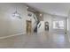 Open living room with tile flooring and abundant natural light at 7633 Raven Hills Dr, Las Vegas, NV 89149