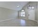 Bright living room boasts tile floors, a window, and plenty of space at 7633 Raven Hills Dr, Las Vegas, NV 89149