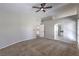 Spacious main bedroom features vaulted ceiling, carpet flooring, and arched doorway to bath at 7633 Raven Hills Dr, Las Vegas, NV 89149