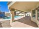Covered patio overlooking the pool and backyard area at 7633 Raven Hills Dr, Las Vegas, NV 89149