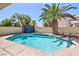 Sparkling pool with a mature palm tree provides a relaxing outdoor oasis at 7633 Raven Hills Dr, Las Vegas, NV 89149