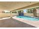 Inviting backyard pool with pristine, clear water, adjacent jacuzzi, and a covered patio at 7633 Raven Hills Dr, Las Vegas, NV 89149