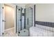 Elegant bathroom shower with glass enclosure and modern tile accents at 7633 Raven Hills Dr, Las Vegas, NV 89149