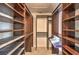 Large walk-in closet with custom shelving and plenty of storage at 7633 Raven Hills Dr, Las Vegas, NV 89149