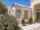 Charming exterior elevation featuring desert landscaping, tile roof and stucco at 7657 Velvet Mist St, Las Vegas, NV 89131