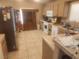 Spacious kitchen with tile floor, modern appliances, and wood cabinets at 7657 Velvet Mist St, Las Vegas, NV 89131
