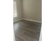Bright bedroom featuring a window and sleek, modern gray floors at 7977 Delft Blue St, Las Vegas, NV 89139