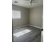 Inviting bedroom with wood-style flooring and natural light from a window at 7977 Delft Blue St, Las Vegas, NV 89139