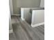 Neutral hallway featuring wood-style flooring and freshly painted walls at 7977 Delft Blue St, Las Vegas, NV 89139