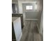Open hallway area with neutral walls and wood-style flooring at 7977 Delft Blue St, Las Vegas, NV 89139