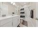 Bright bathroom featuring white cabinets, a shower with a tub, and neutral-colored walls at 80 Cathedral Wash Pl, Henderson, NV 89011