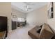 Bedroom featuring a ceiling fan, desk, and a futon at 80 Cathedral Wash Pl, Henderson, NV 89011