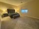 Inviting bedroom with plush carpeting, neutral walls, and stylish furnishings creating a tranquil retreat at 80 Cathedral Wash Pl, Henderson, NV 89011
