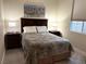 Comfortable bedroom features a large bed, soft lighting, and picturesque art, offering a relaxing retreat at 80 Cathedral Wash Pl, Henderson, NV 89011