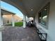 Inviting covered patio featuring stone pavers, outdoor seating, and picturesque mountain views for serene outdoor living at 80 Cathedral Wash Pl, Henderson, NV 89011