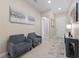 Inviting entryway with neutral tones, stylish furniture, and decorative wall art at 80 Cathedral Wash Pl, Henderson, NV 89011