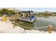 Scenic view of a floating stage on a lake, backed by architecturally interesting buildings at 80 Cathedral Wash Pl, Henderson, NV 89011