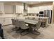 Kitchen with modern lighting, stainless appliances, and dining area at 80 Cathedral Wash Pl, Henderson, NV 89011