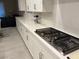 Spacious quartz countertop with stainless gas stovetop in bright modern kitchen at 80 Cathedral Wash Pl, Henderson, NV 89011