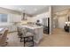 Modern kitchen features stainless steel appliances, a kitchen island with seating, and ample counter space at 80 Cathedral Wash Pl, Henderson, NV 89011