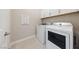 Convenient laundry room equipped with a washer and dryer at 80 Cathedral Wash Pl, Henderson, NV 89011