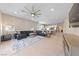 Spacious living area with a large sectional, open to the kitchen and dining area at 80 Cathedral Wash Pl, Henderson, NV 89011