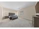 Spacious main bedroom features soft carpeting, ample natural light, and a calming atmosphere at 80 Cathedral Wash Pl, Henderson, NV 89011