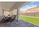 Covered patio featuring a stone-paved floor and a dining table, perfect for outdoor entertaining at 80 Cathedral Wash Pl, Henderson, NV 89011