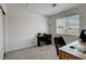 Well-lit office space with modern desk, rolling office chair, and large window at 8048 Astrology Ct # 201, Las Vegas, NV 89128