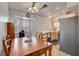 Bright dining nook with a rustic table, access to outdoors, and a view of the kitchen at 8048 Astrology Ct # 201, Las Vegas, NV 89128