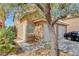 The building's exterior features a gated entrance, a front window and access to the garage at 8048 Astrology Ct # 201, Las Vegas, NV 89128
