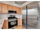 Bright kitchen features stainless steel appliances, light wood cabinets, and modern fixtures at 8048 Astrology Ct # 201, Las Vegas, NV 89128