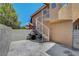 Outdoor patio featuring a spiral staircase, concrete pavers, and a barbecue grill at 8048 Astrology Ct # 201, Las Vegas, NV 89128