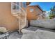Outdoor living space featuring a spiral staircase, concrete pavers, and a grill at 8048 Astrology Ct # 201, Las Vegas, NV 89128