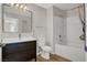 Bathroom features a vanity with sink, mirror, new lighting and combined shower and tub at 8070 W Russell Rd # 2052, Las Vegas, NV 89113