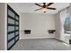 Bright bedroom features a modern sliding door closet, ceiling fan, and natural light at 8070 W Russell Rd # 2052, Las Vegas, NV 89113